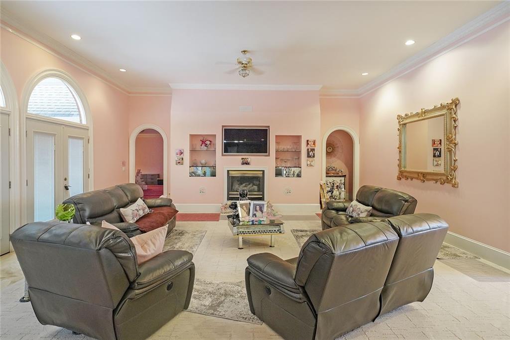 1827 Poplar Springs Road Hiram, GA 30141 - Photo 10 of 45 a living room with furniture fireplace and a flat screen tv