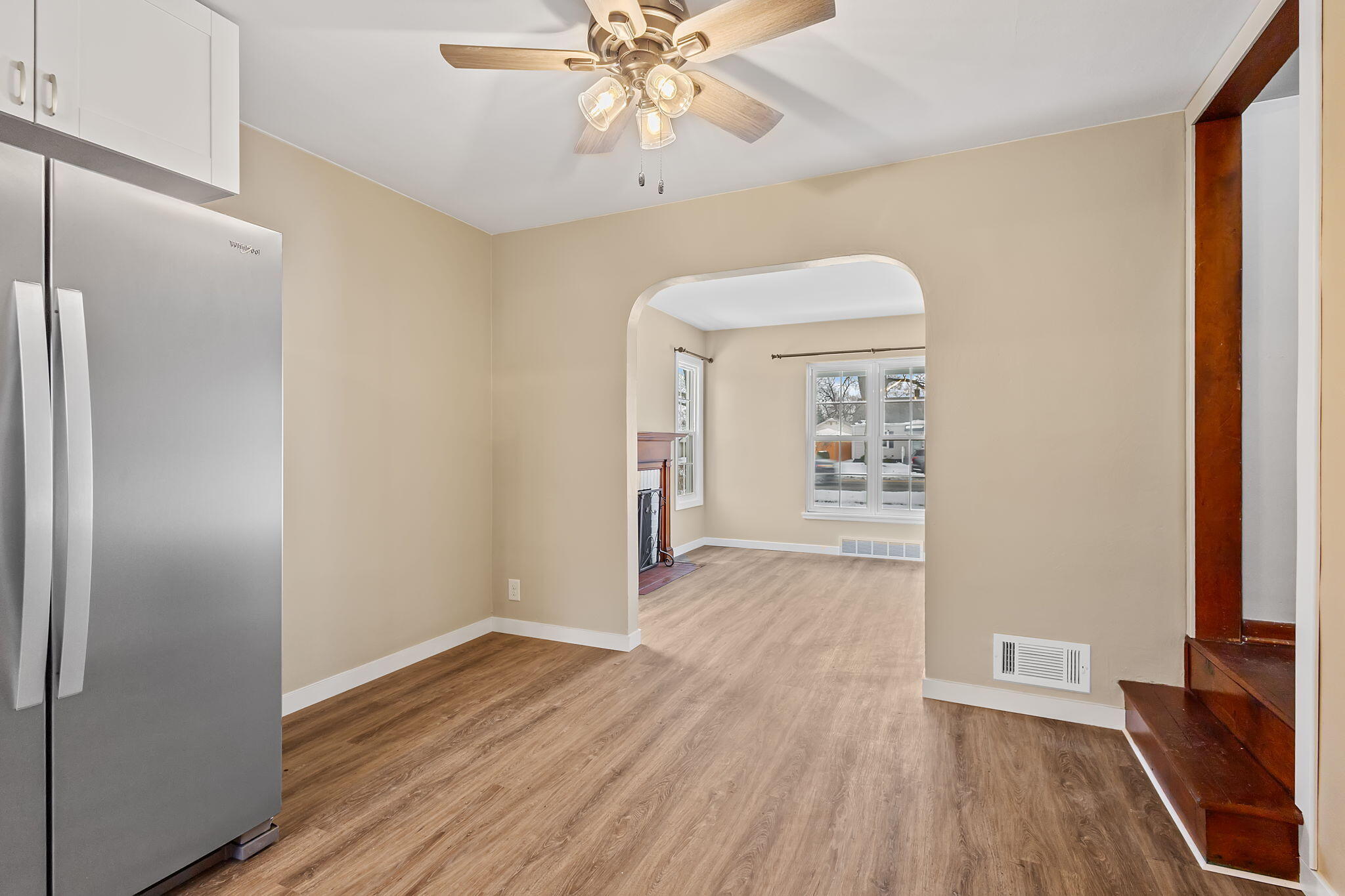 314 Cline Avenue Griffith, IN 46319 - Photo 12 of 36 a view of a hallway with wooden floor and a chandelier