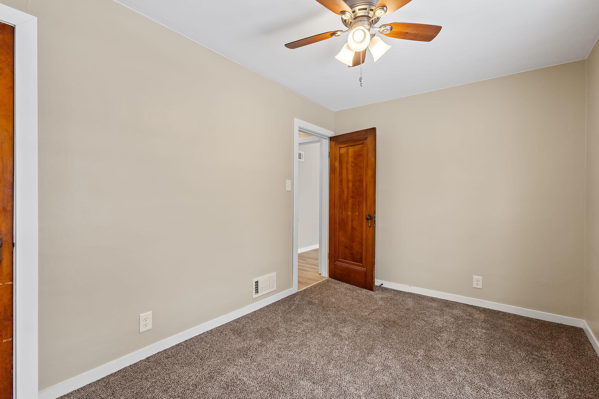 314 Cline Avenue Griffith, IN 46319 - Photo 15 of 36 an empty room with closet and a chandelier fan