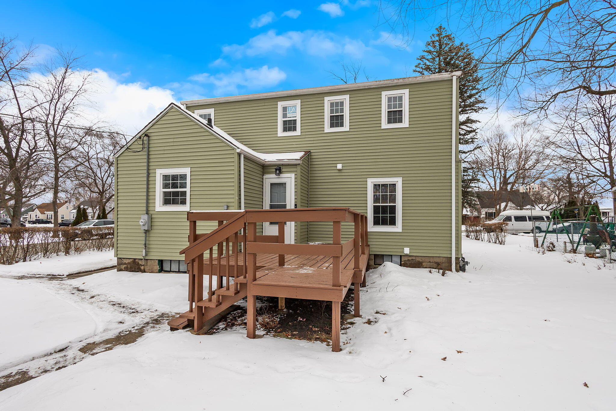 314 Cline Avenue Griffith, IN 46319 - Photo 26 of 36 a view of a house with a yard covered in snow