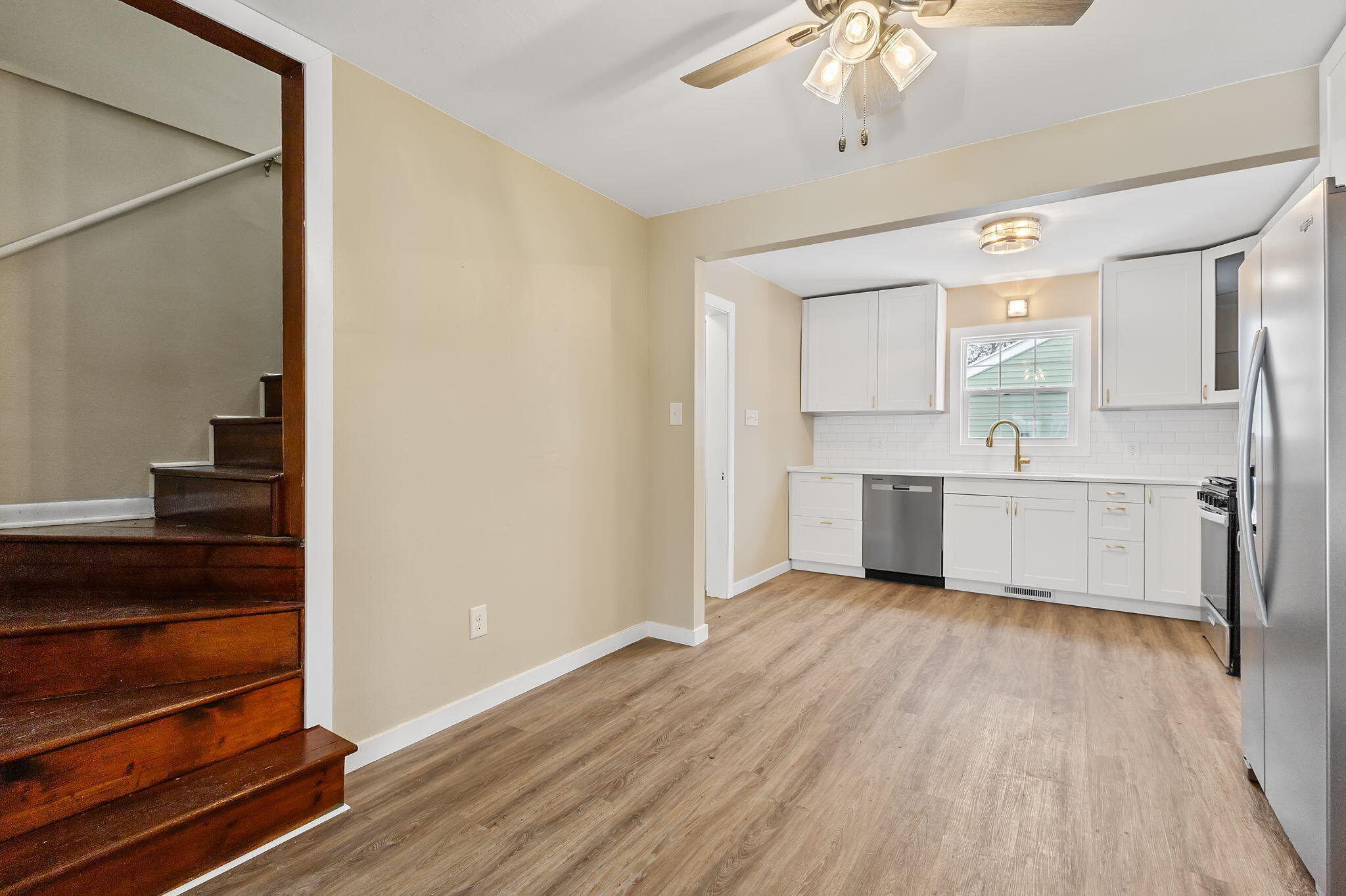 314 Cline Avenue Griffith, IN 46319 - Photo 29 of 36 a view of kitchen with wooden floor electronic appliances and cabinets