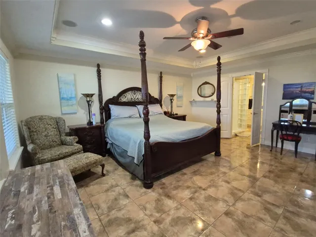a bathroom with a double vanity sink toilet and shower
