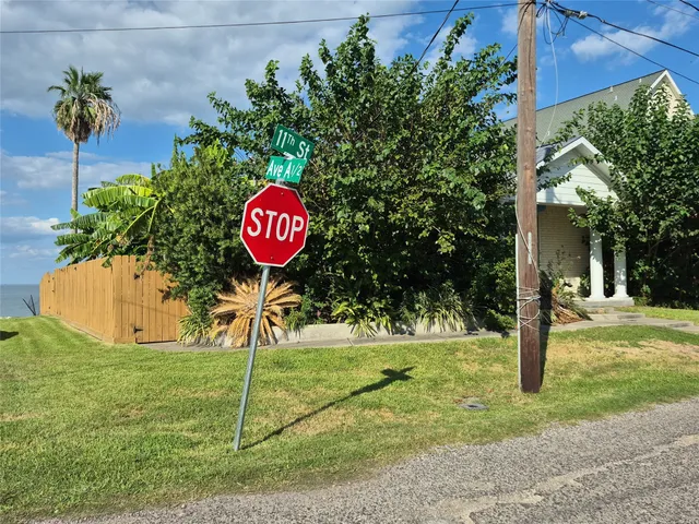 a view of a house with yard and sitting area