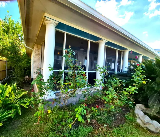 front view of the house with potted plants