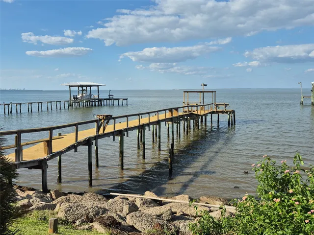 a swimming pool with chairs