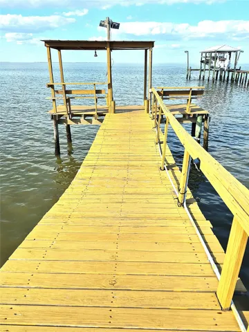 a view of a swimming pool with outdoor seating