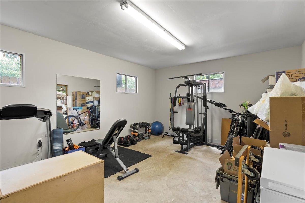 4491 Garnett Road Memphis, TN 38117 - Photo 24 of 32 Versatile bonus room featuring light-toned walls, multiple windows, and concrete flooring