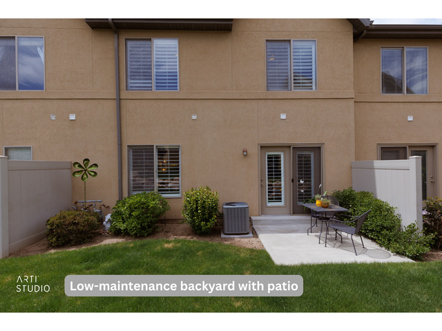 6761 950 East Midvale, UT 84047 - Photo 26 of 44 Private backyard with concrete patio, enclosed by a tan vinyl fence