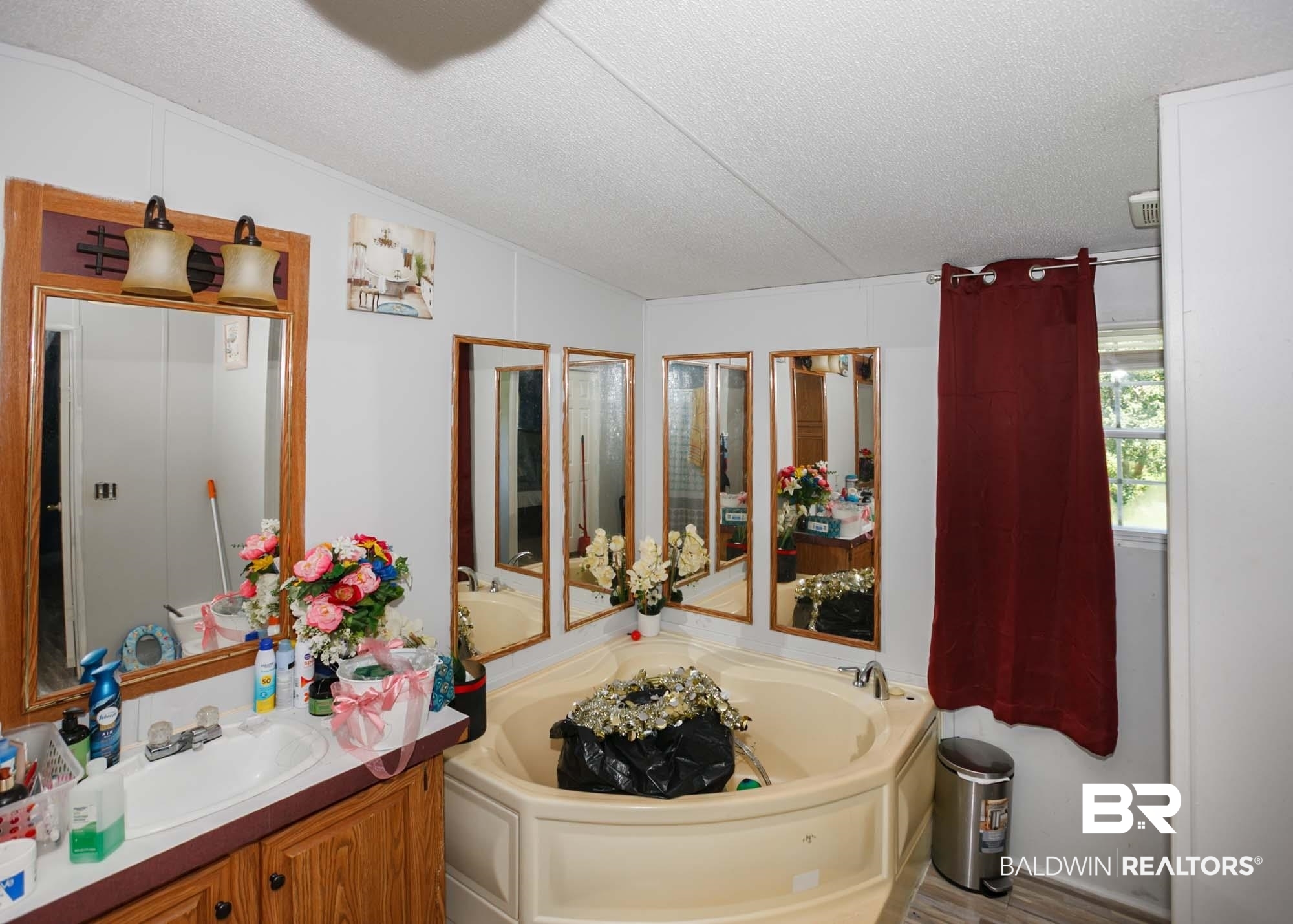 14005 County Road 49 Foley, AL 36535 - Photo 19 of 38 Full bathroom featuring vanity, a textured ceiling, and a garden tub