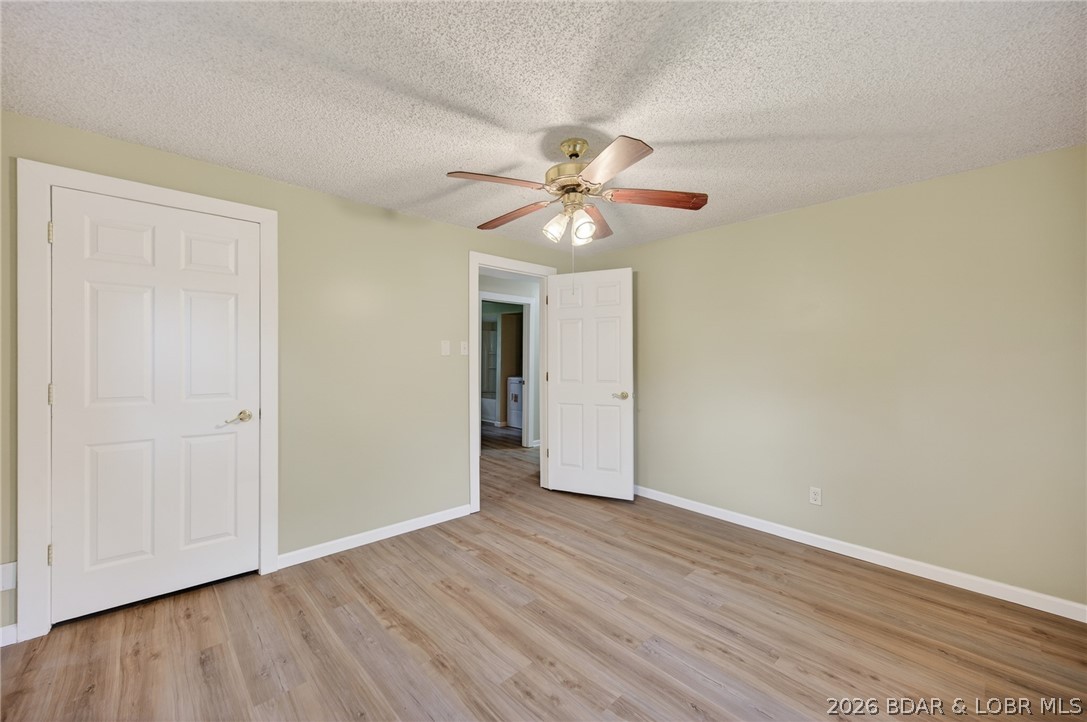 177 Storage Road Eldon, MO 65026 - Photo 24 of 34 Another spacious bedroom is featured in guest bedr