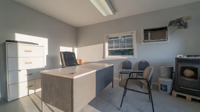 a room that has a couch and a stove in it