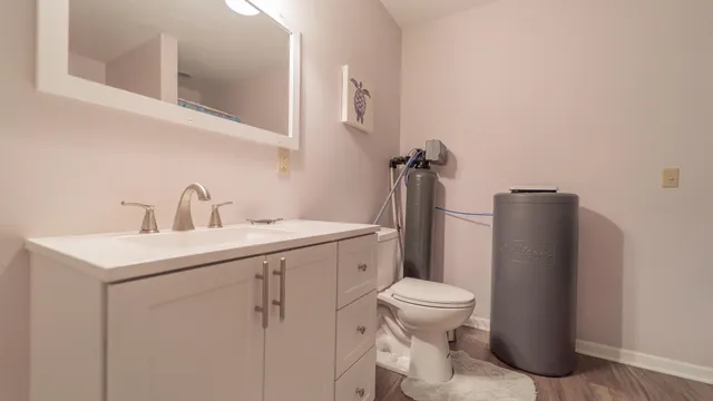 a bathroom with a sink toilet and a mirror
