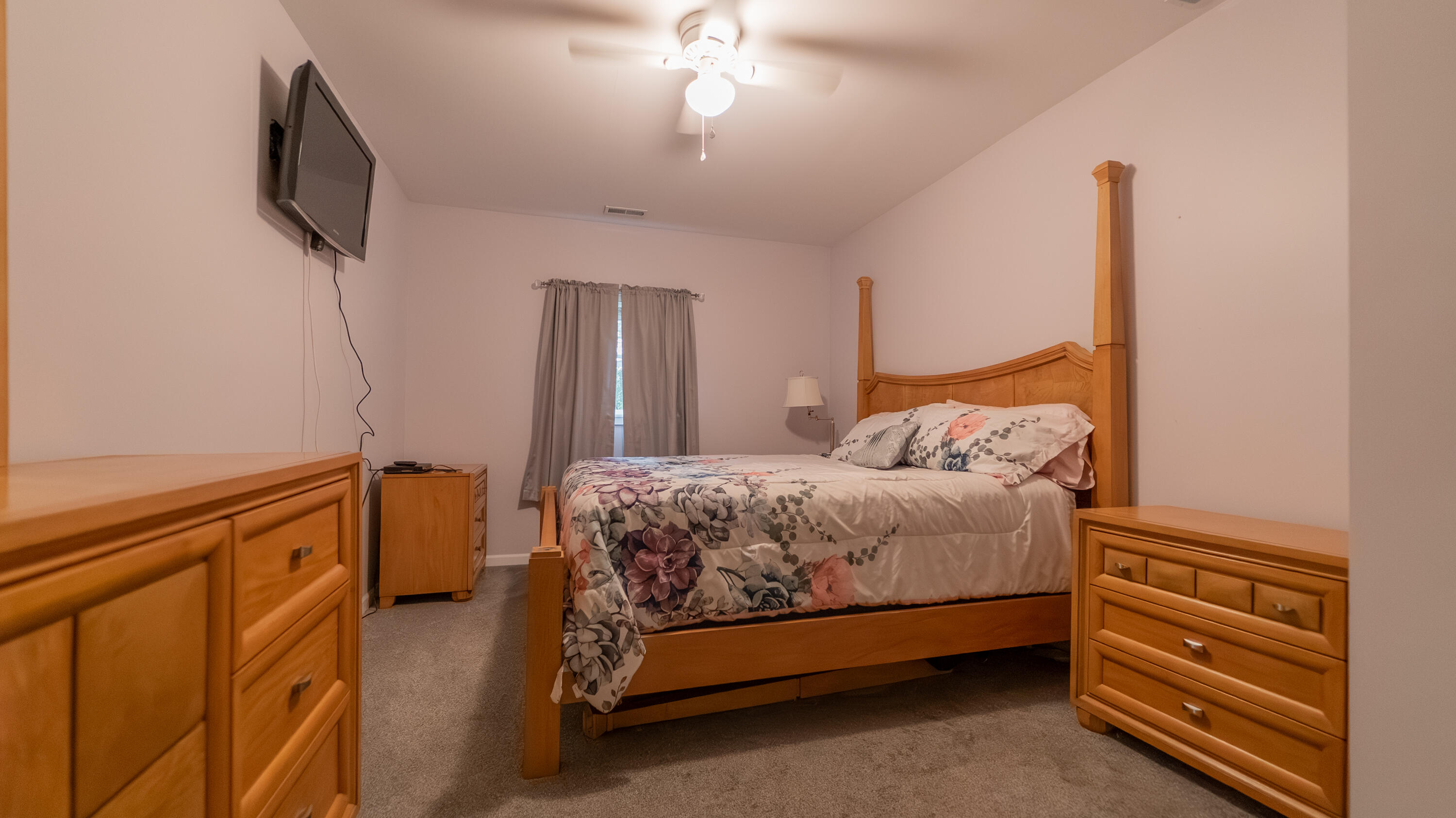 8790 Highway 35 Monterey, IN 46960 - Photo 10 of 22 a bedroom with a bed and a flat tv screen on dresser