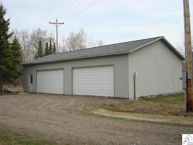 7595 Arkola Road Cotton, MN 55724 - Photo 2 of 14 4 car (30x50) detached garage. Insulated and heatable with in-floor heat with an outdoor wood stove
