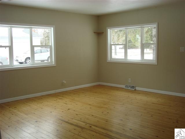 7595 Arkola Road Cotton, MN 55724 - Photo 4 of 14 Large, open living room with lots of sunlight.