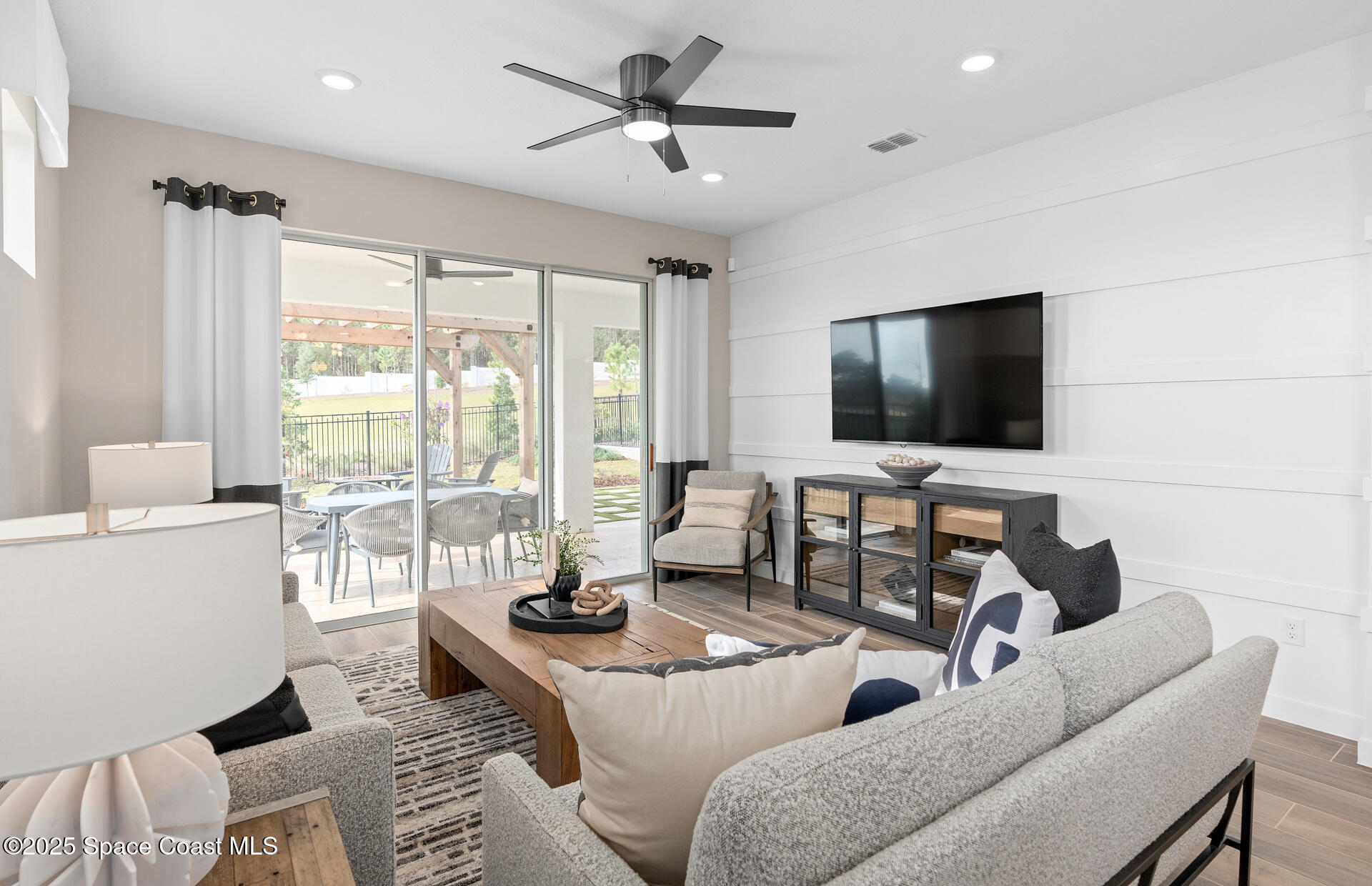3494 Bubbles Court Melbourne, FL 32901 - Photo 15 of 22 a living room with furniture and a flat screen tv