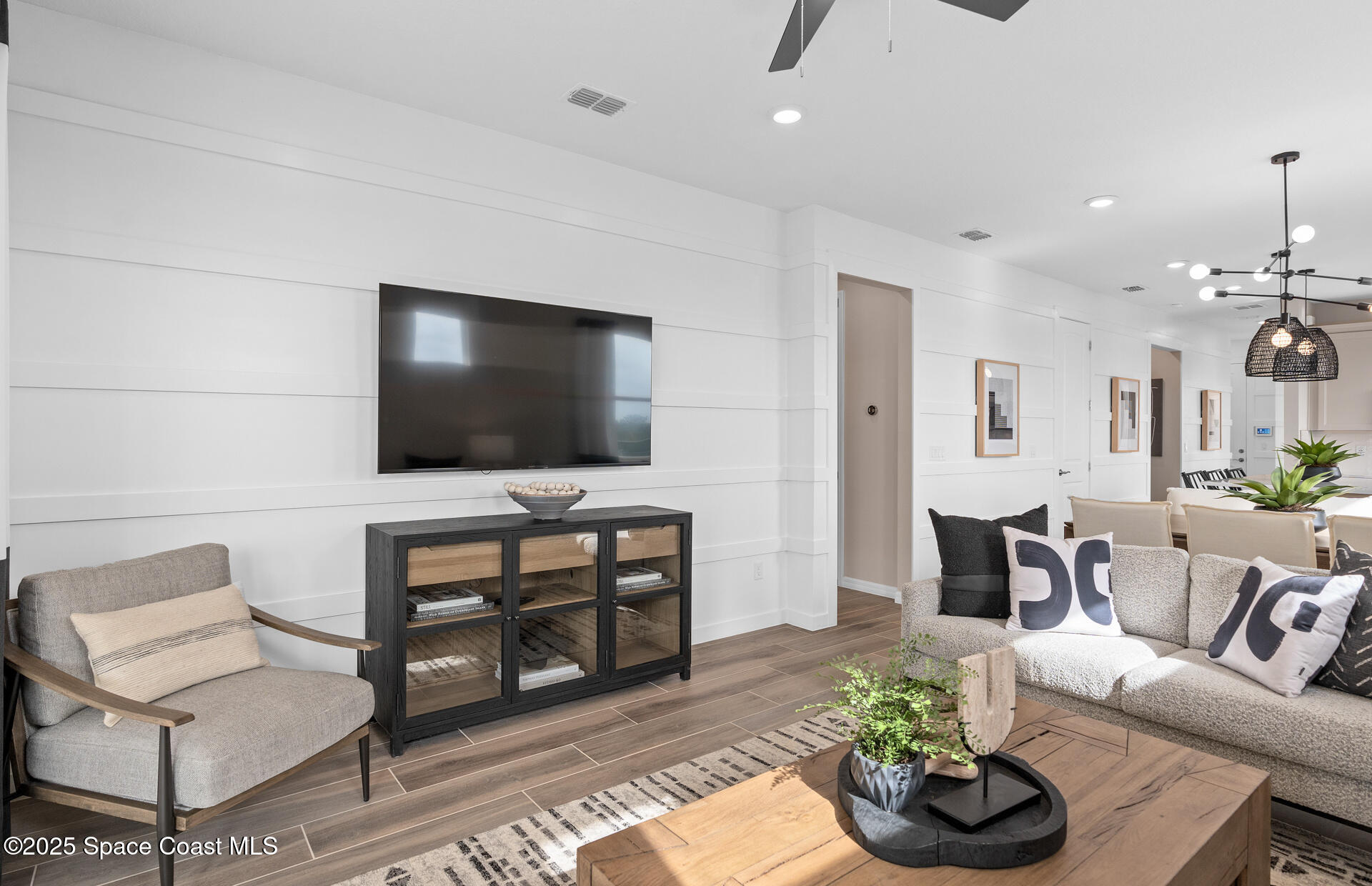 3494 Bubbles Court Melbourne, FL 32901 - Photo 16 of 22 a living room with furniture and a flat screen tv