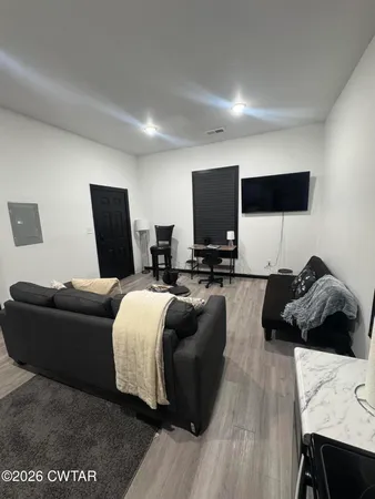 a view of a room with furniture and stairs