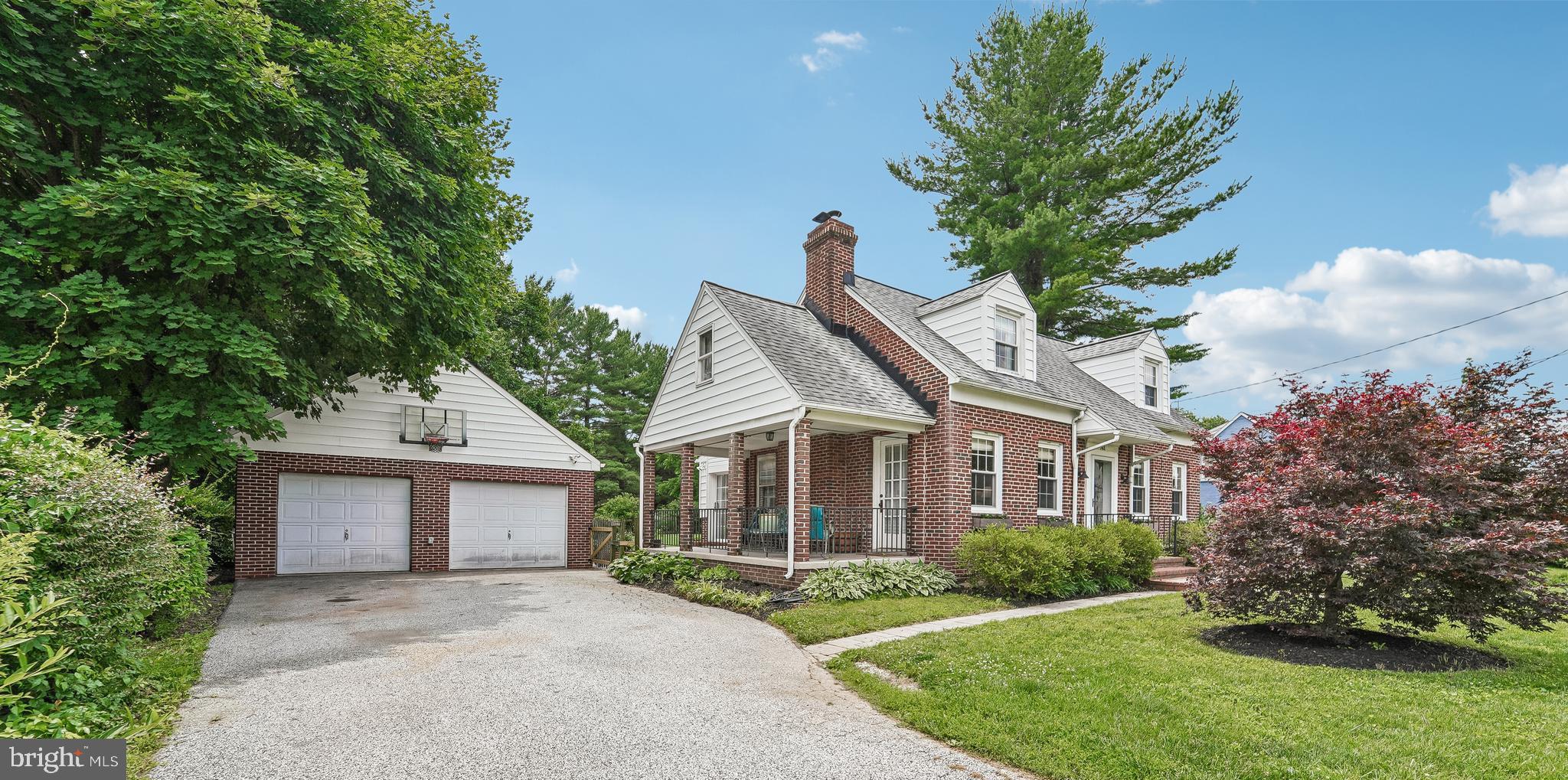 All brick Cape Cod w/Side porch and 2 Car Garage
