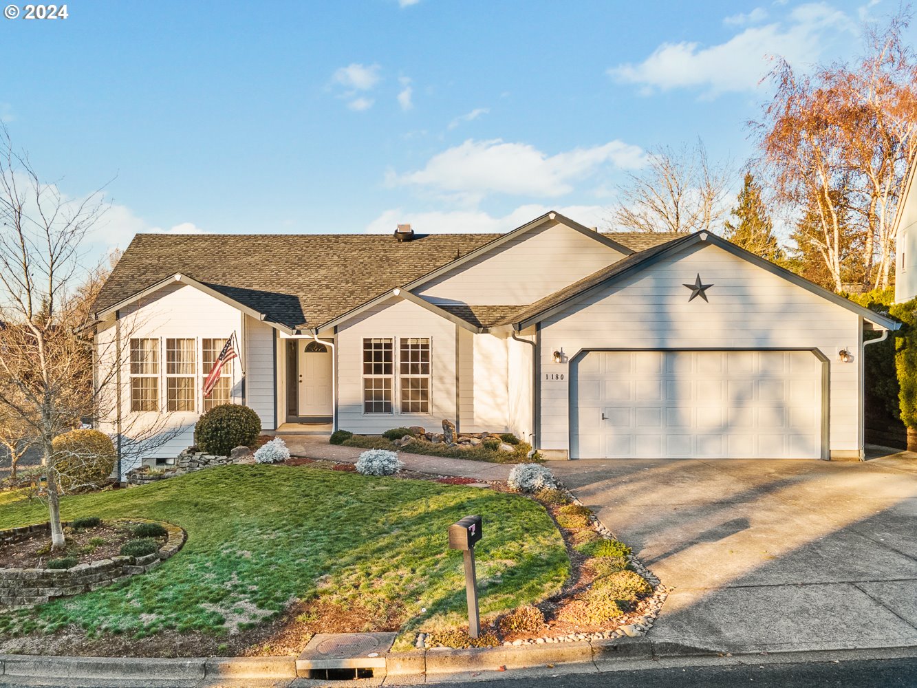 1180 North 1st Avenue Ridgefield, WA 98642 - Photo 1 of 48 a front view of a house with garden