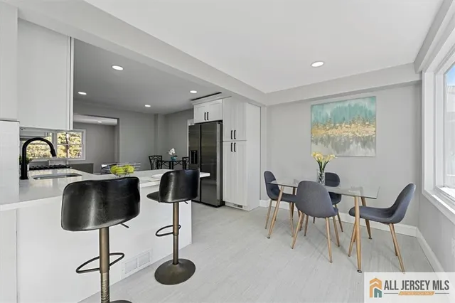 a view of a dining room with furniture window and outside view