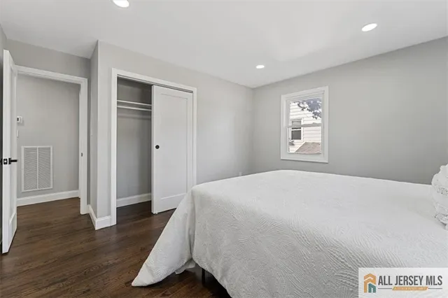 a view of hallway with wooden floor
