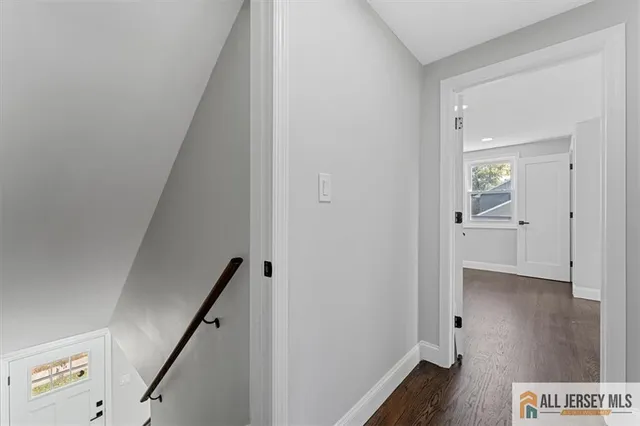 an empty room with wooden floor