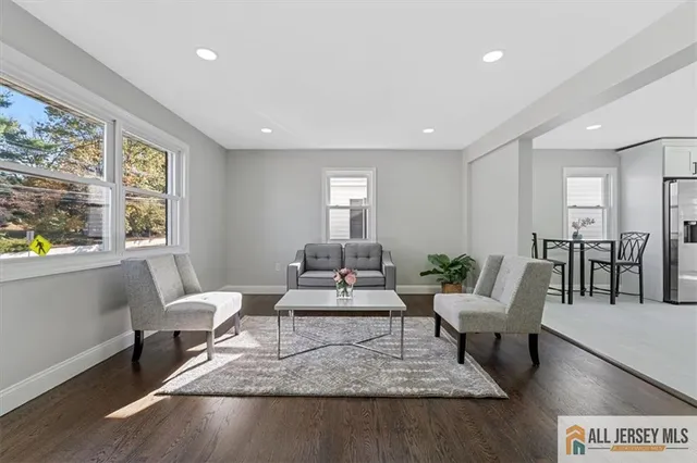 a living room with furniture and a table