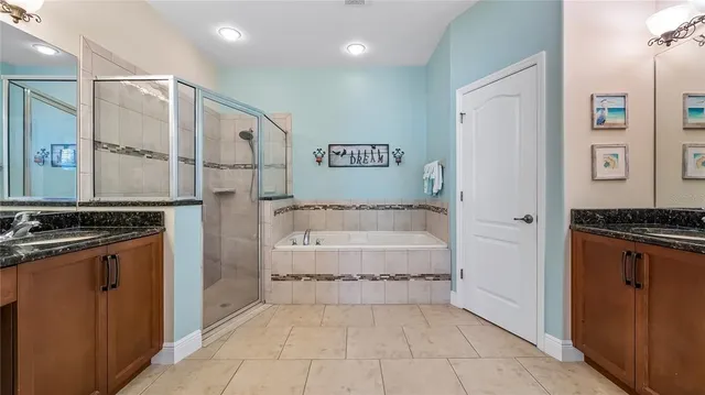 a bathroom with a tub and shower