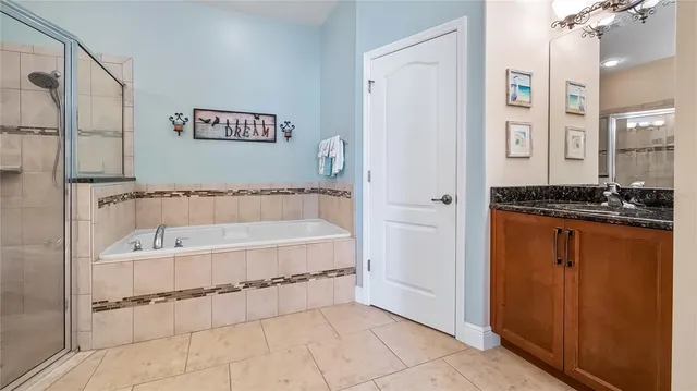 a spacious bathroom with a bathtub and a shower