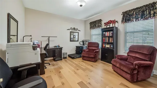 a living room with furniture a air conditioner and a window