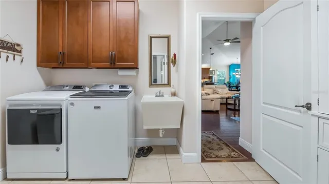 a view of a storage and utility room with a sink