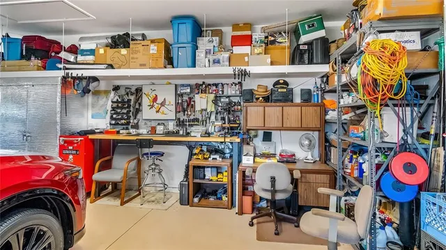 a view of a patio with a table chairs and a backyard