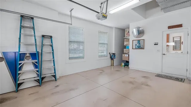 a view of a chair and tables in the patio