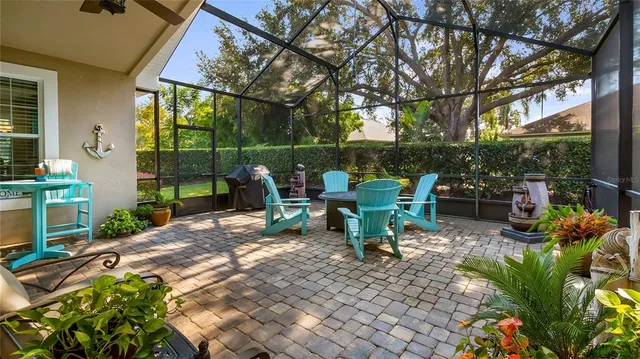 a view of a patio with table and chairs and potted plants