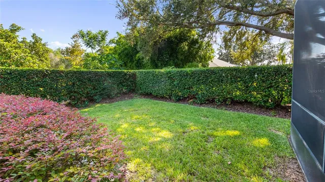 a view of a patio with table and chairs and potted plants
