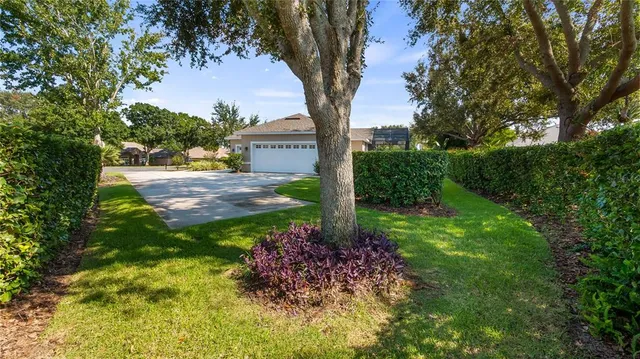 a view of a lake with a table and chairs