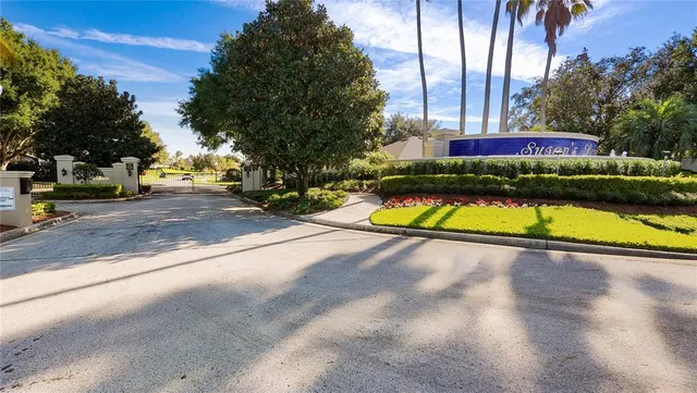 an aerial view of a house with a yard basket ball court and outdoor seating