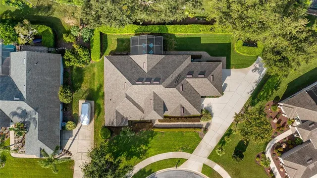 an aerial view of residential houses with outdoor space