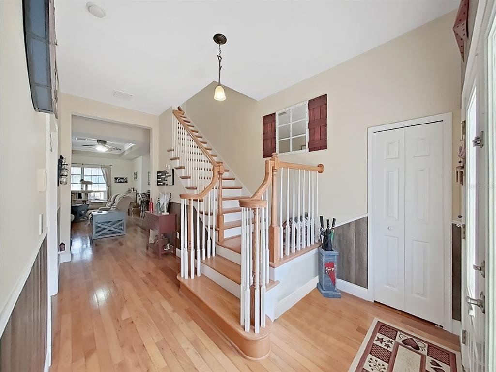 10639 Brave Lane Hudson, FL 34667 - Photo 17 of 54 a view of a livingroom with wooden floor and stairs