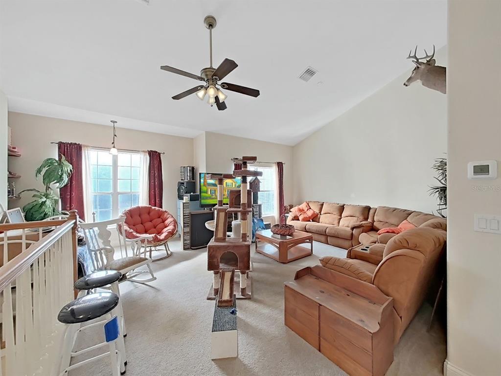 10639 Brave Lane Hudson, FL 34667 - Photo 19 of 54 a living room with furniture