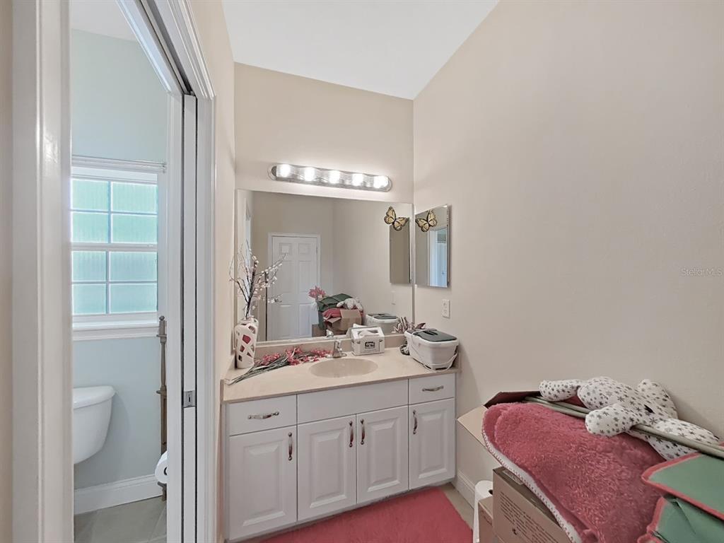 10639 Brave Lane Hudson, FL 34667 - Photo 24 of 54 a bathroom with a double vanity sink and a mirror