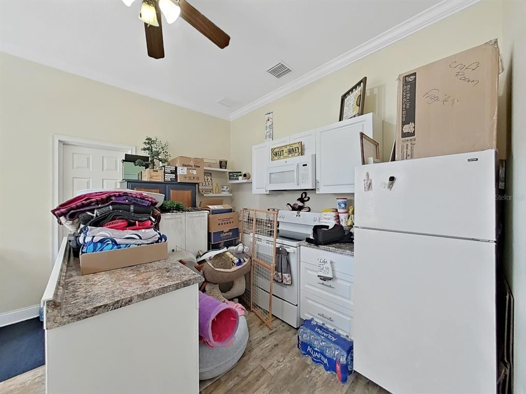 10639 Brave Lane Hudson, FL 34667 - Photo 26 of 54 a room with storage and utility