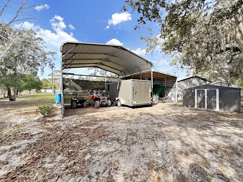 10639 Brave Lane Hudson, FL 34667 - Photo 40 of 54 a view of a car park in front of a house