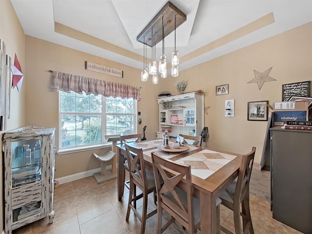 10639 Brave Lane Hudson, FL 34667 - Photo 9 of 54 a view of a dining room with furniture window and outside view