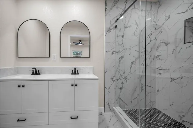a bathroom with a sink and mirror