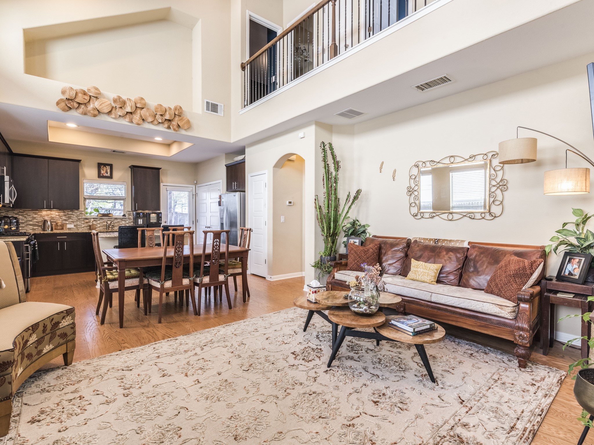 7709 Menchaca Road, Unit 32 Austin, TX 78745 - Photo 1 of 1 Living area featuring arched walkways, visible vents, and light wood-type flooring