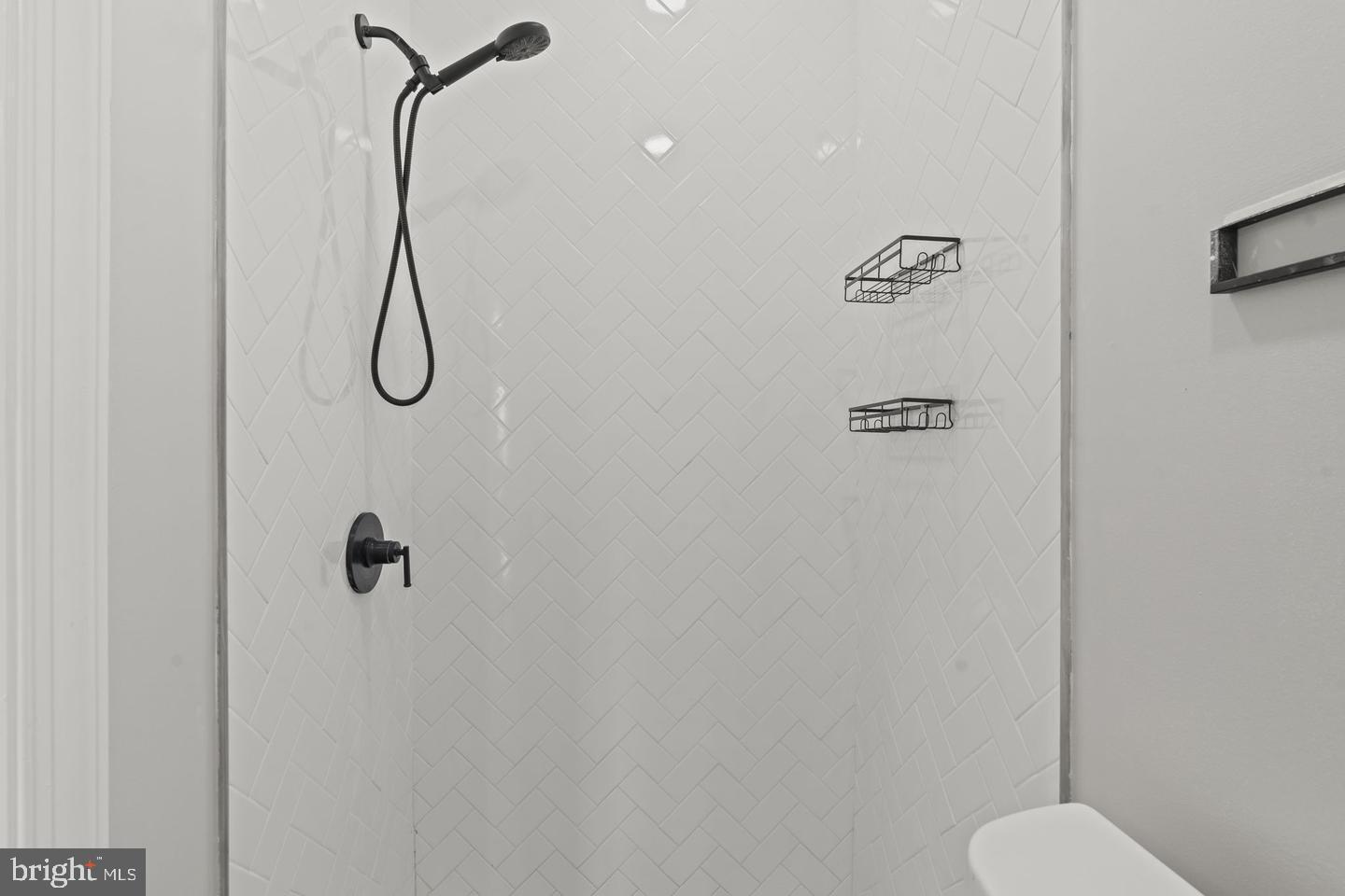 5237 Chester Avenue, Unit 1F Philadelphia, PA 19143 - Photo 28 of 40 Sleek modern shower with elegant tiles.