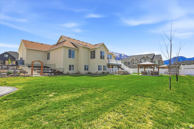 283 North 500 West Mapleton, UT 84664 - Photo 88 of 102 Rear view of property featuring a gazebo, a patio area, and a mountain view.