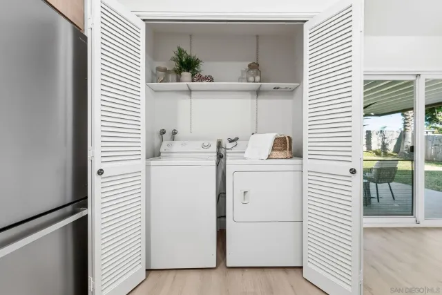 a utility room with dryer and washer